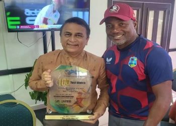 At Queen's Park Cricket Club, Sunil Gavaskar is honored by West Indies legend Brian Lara.