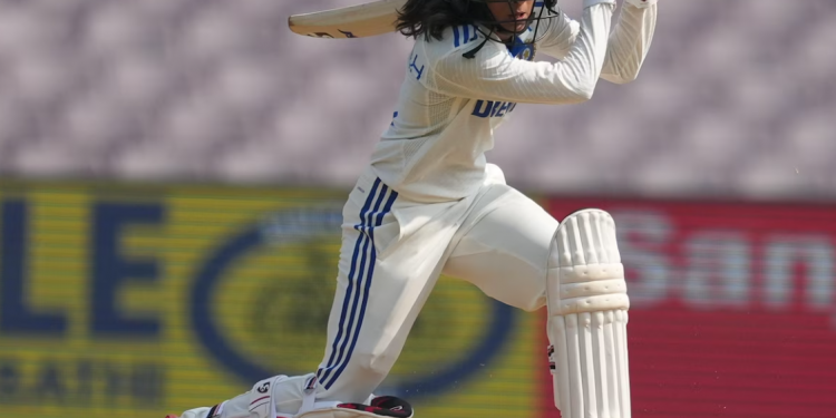 Following their historic victory over Australia, Jemimah Rodrigues celebrates with her teammates and support staff.