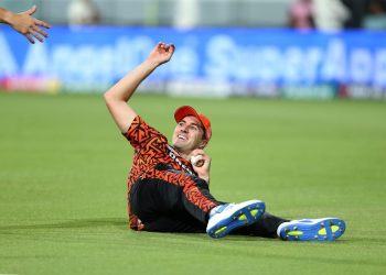 [VIEW] IPL 2025: A video of SRH captain Pat Cummins amusingly carrying Mitchell Marsh's placard onto the team bus gets viral